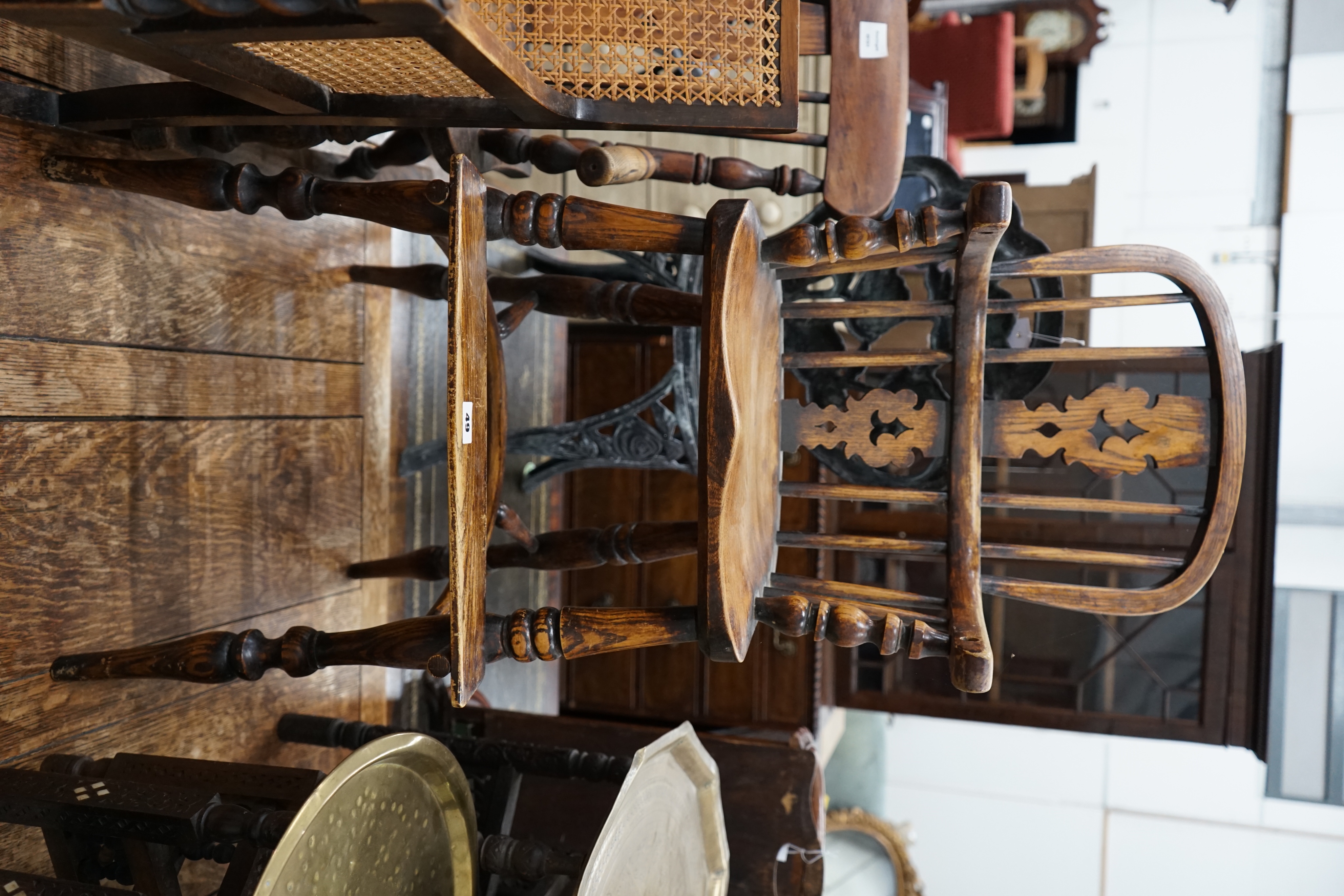 A Victorian elm and beech Windsor child's rocking chair, a Victorian style Windsor high chair and one other child's chair